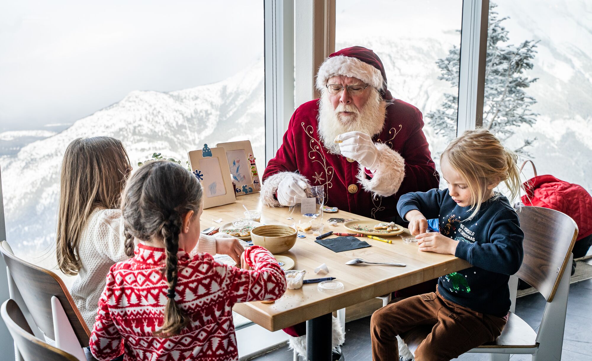 Santa makes crafts with kids at Mountaintop Christmas at the Banff Gondola in Banff National Park.